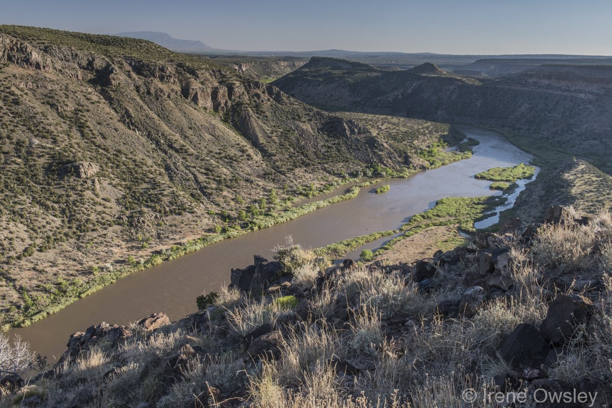 Sheer volcanic cliffs of White Rock Canyon with petroglyphs