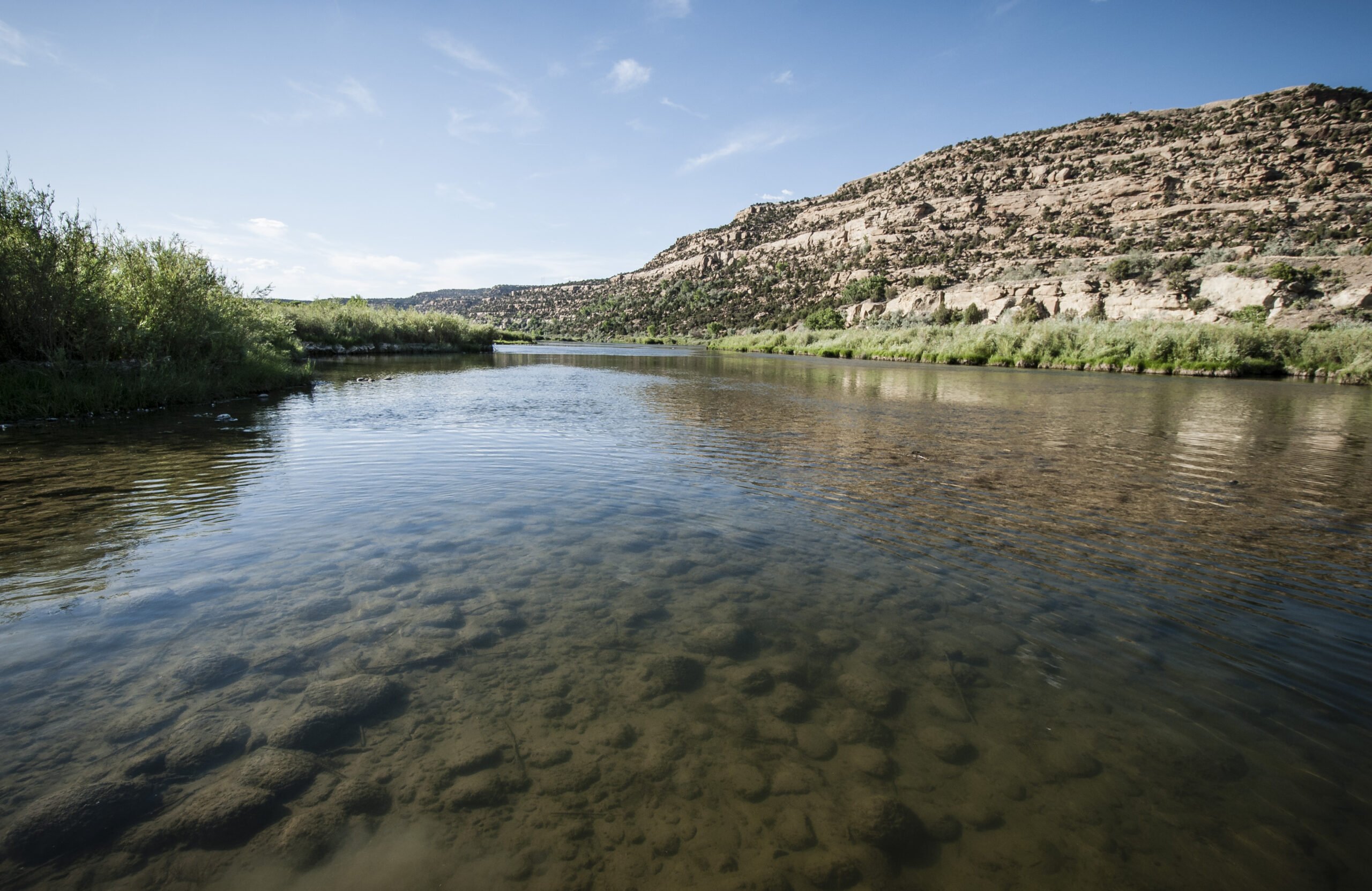San Juan River flowing through red rock landscape near Shiprock